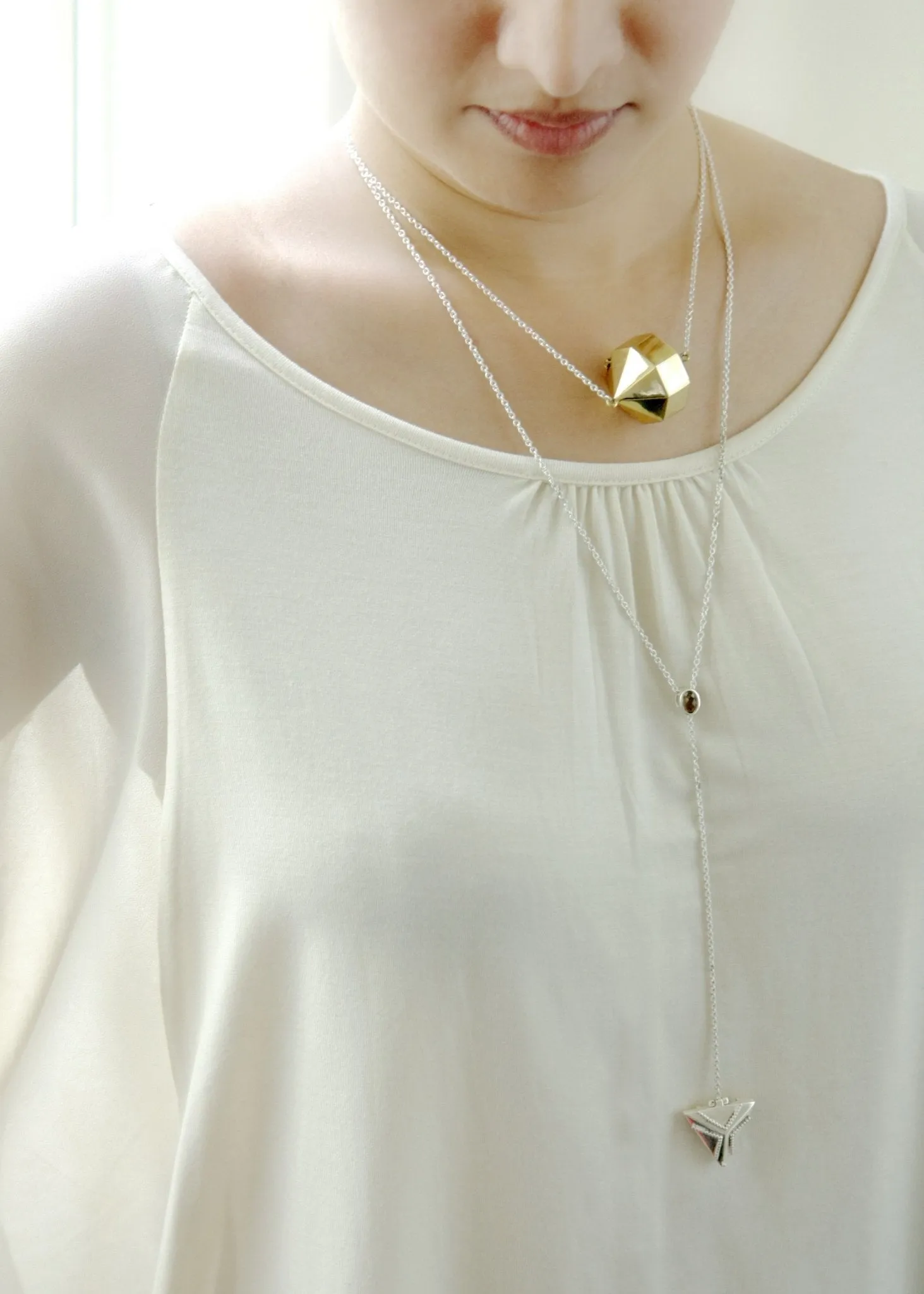 Dainty, long, bi-metal lariat necklace with gold plated brass triangular locket on sterling silver chain