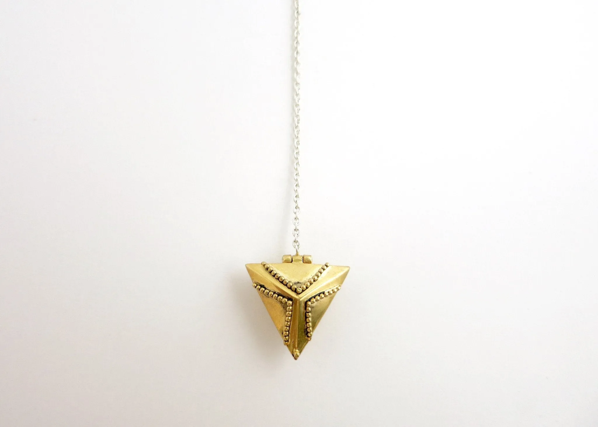 Dainty, long, bi-metal lariat necklace with gold plated brass triangular locket on sterling silver chain